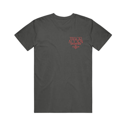 A black short-sleeve Taylor Acorn t-shirt features red text on the left chest with Taylor Acorn above smaller Survivor Two lettering and a small decorative graphic, making it a standout printed shirt.