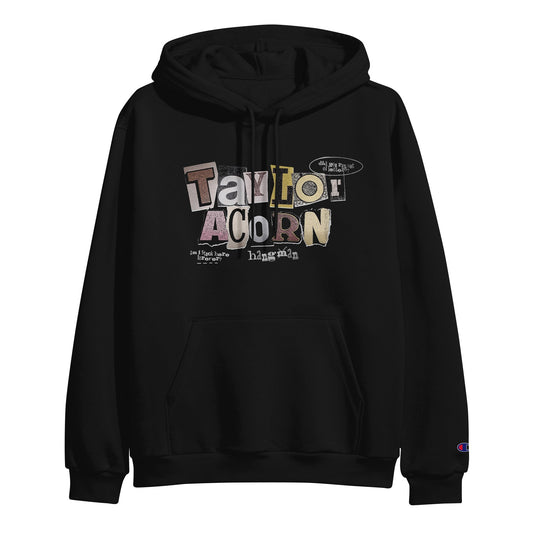 A black pullover hoodie by Taylor Acorn featuring hangin on the front in colorful magazine-style cutout letters. Includes front pocket and drawstrings for comfort.