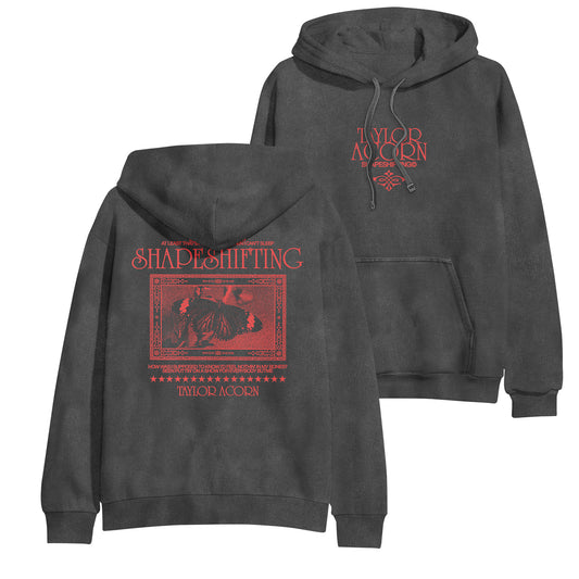 A black Taylor Acorn Comfort Colors hoodie with red designs; Taylor Acorn text on the front, and Shapeshifting plus butterfly artwork and decorative text on the back—like your favorite printed tee, but cozier.